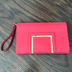 Bright pink Jimmy Choo clutch.